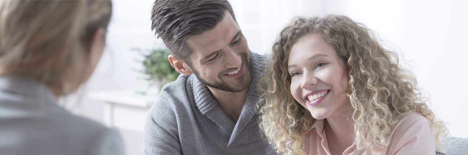 Happy young adult attractive couple smiling during therapy